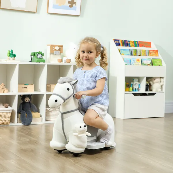 Caballo eléctrico con música Batería 6V Juguete eléctrico Toque Suave Ruedas Silenciosas de PU Movimiento hacia el Frente Prenda para niños de 1,5 a 5 Años 74x34x51 cm Blanco